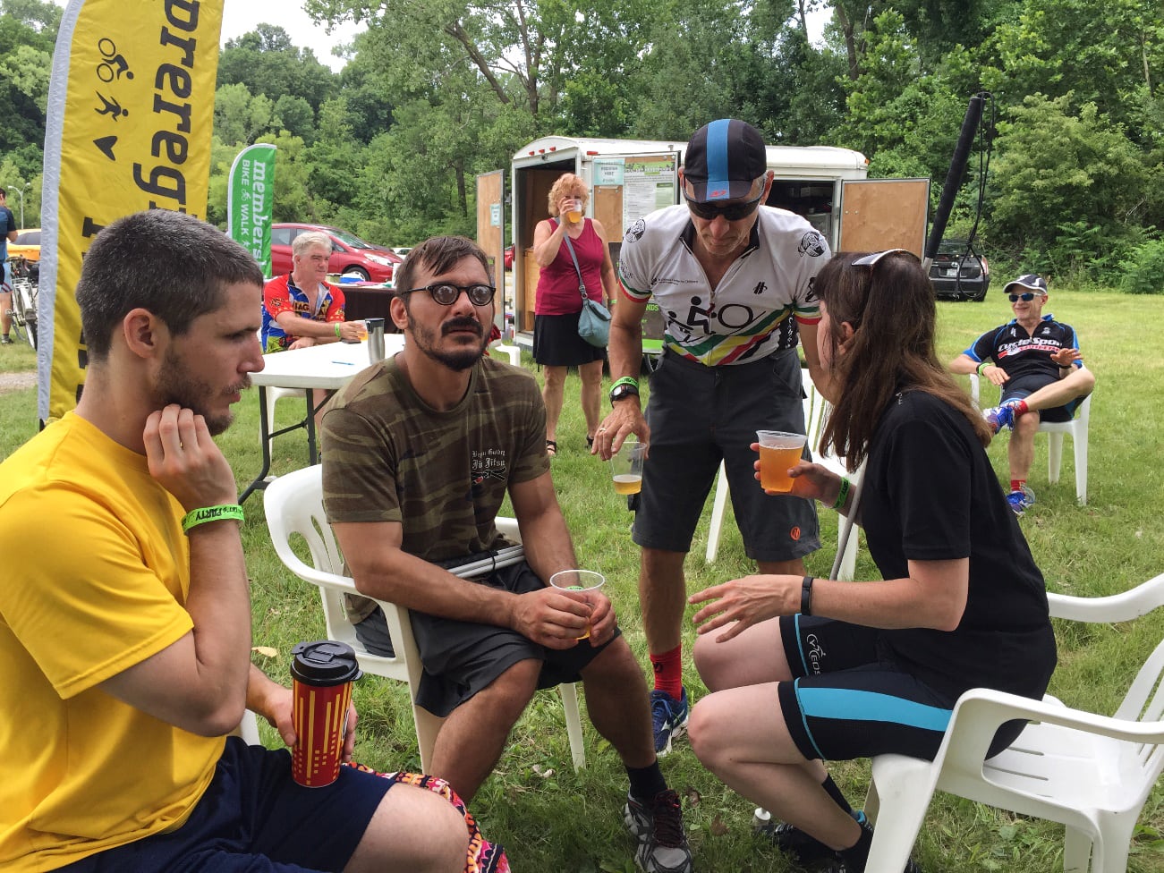 Blind and visually impaired cyclists enjoying a cold beer after a Trailnet ride.
