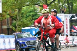 Photo of a tandem with the captain dressed up as Santa and with a blind stoker (the person in the rear seat)
